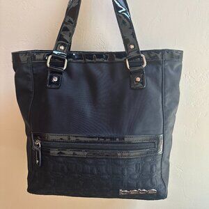 bebe Black handbag with silver logo and magnet closure.  Outside zipper.